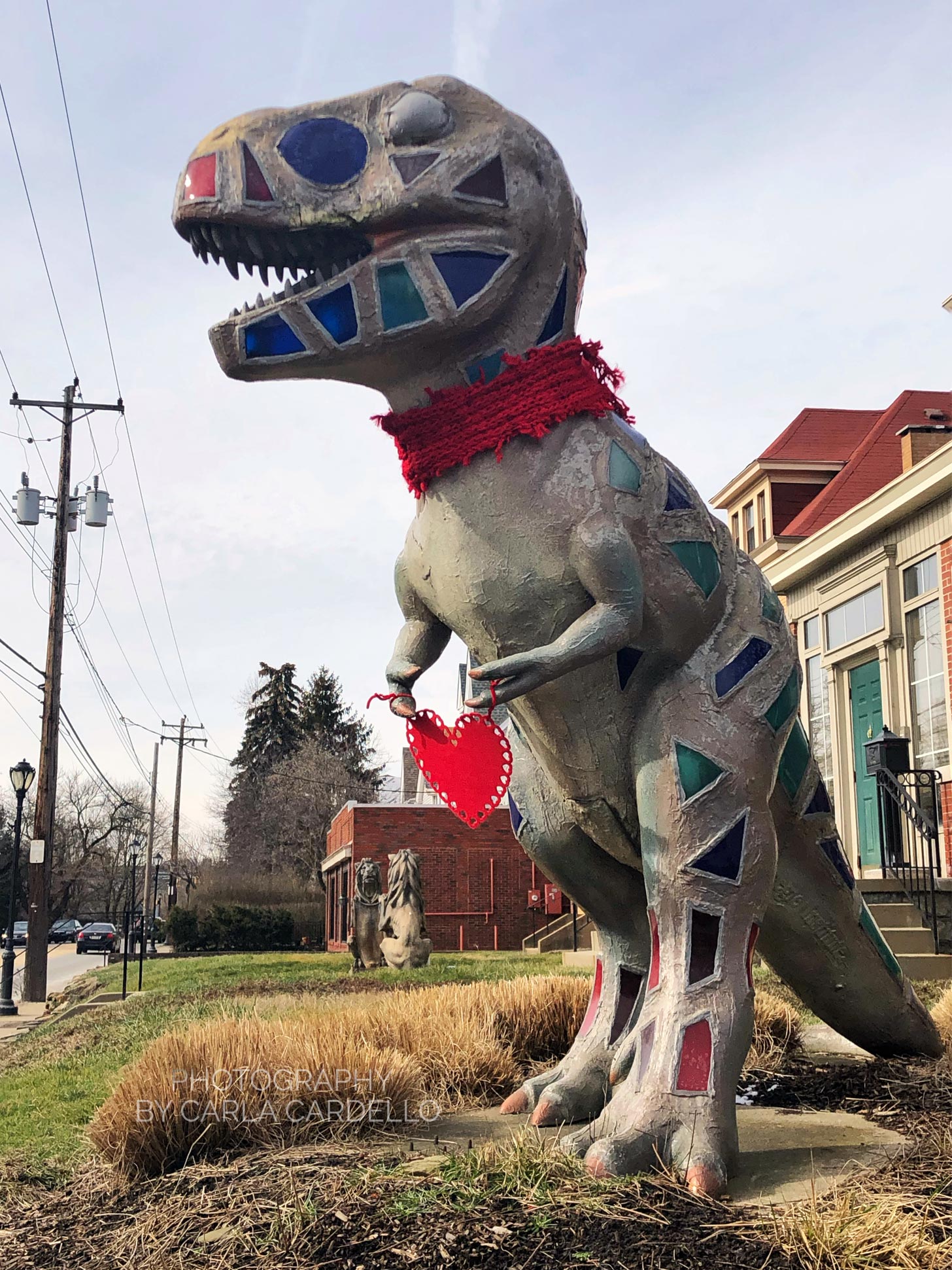 Lunasaurus Lux holding a heart Pittsburgh Dinosaur Statue