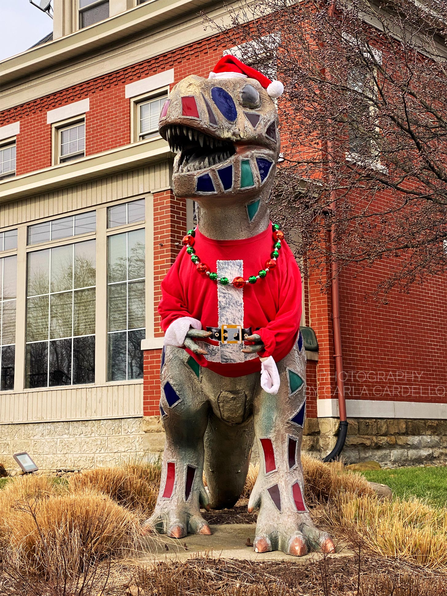 Lunasaurus Lux dressed up as Santa Pittsburgh Dinosaur Statue